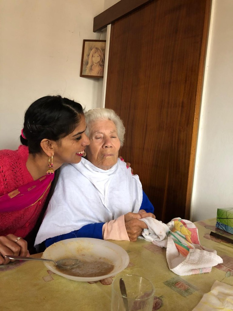 Volunteer caring for an elder with warmth and respect